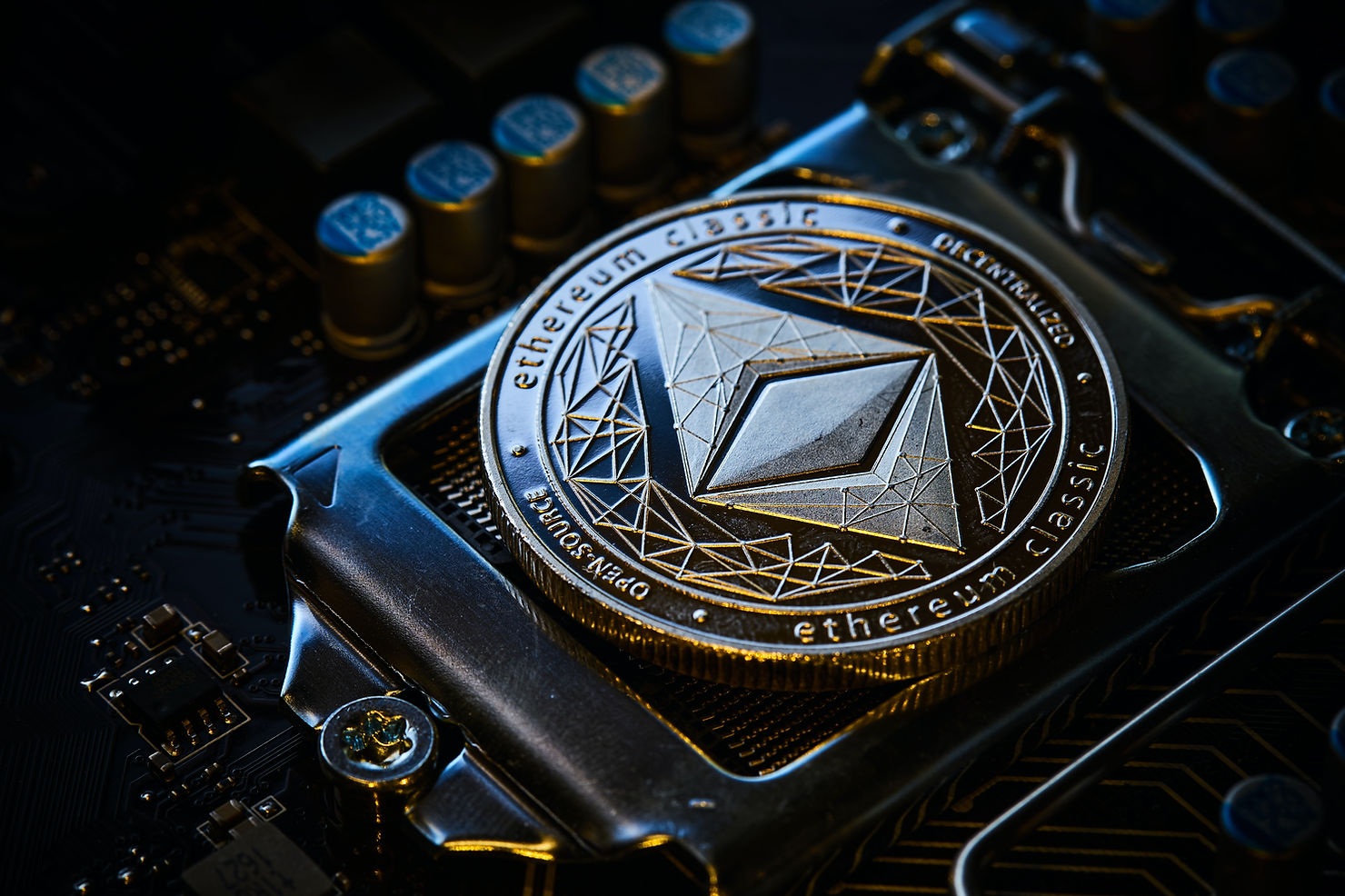 The Crypto Gate Blog Image - Ethereum coin resting atop a motherboard